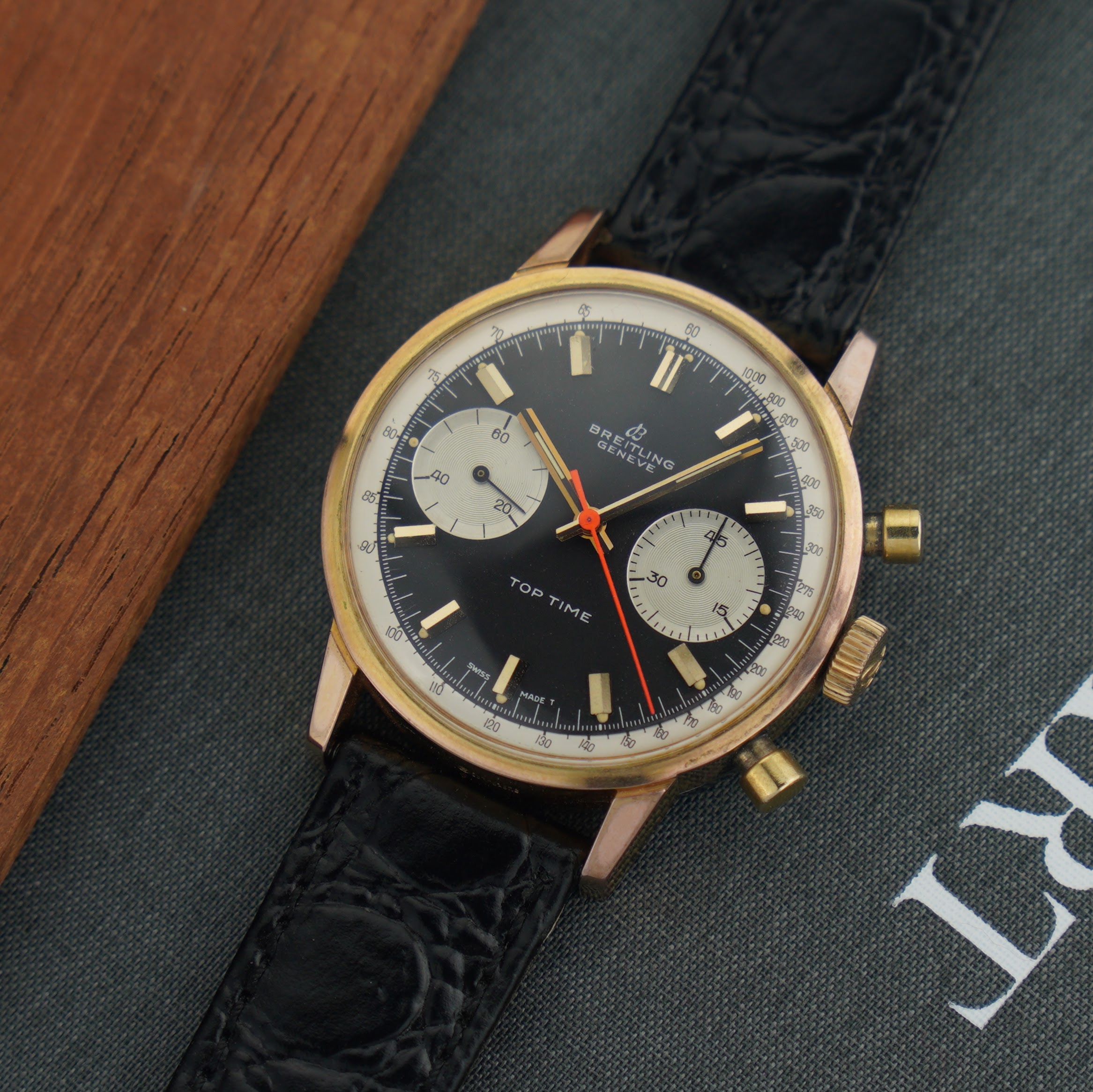 Breitling Top Time ref. 2000-33 from 1969. 36mm gold-plated case, reversed panda dial and Valjoux 7733 movement.