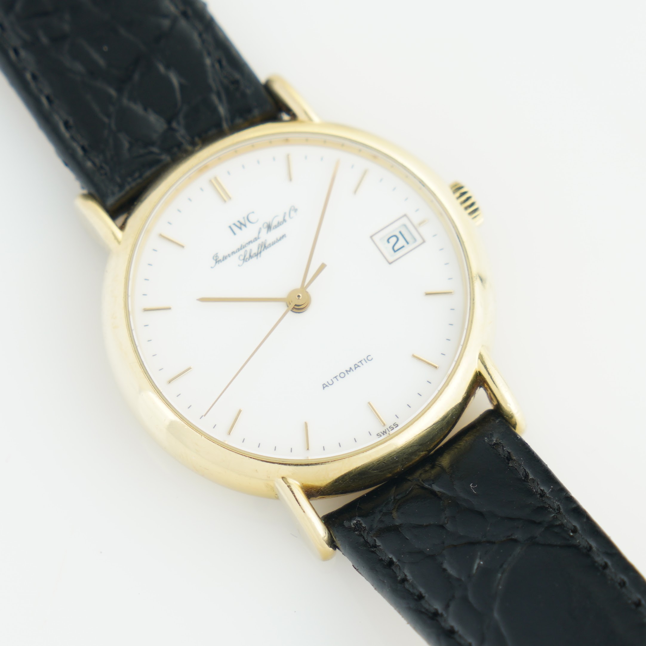 IWC Portofino 3513 from the 1990s. 34mm 18k solid gold case, white dial and automatic movement.